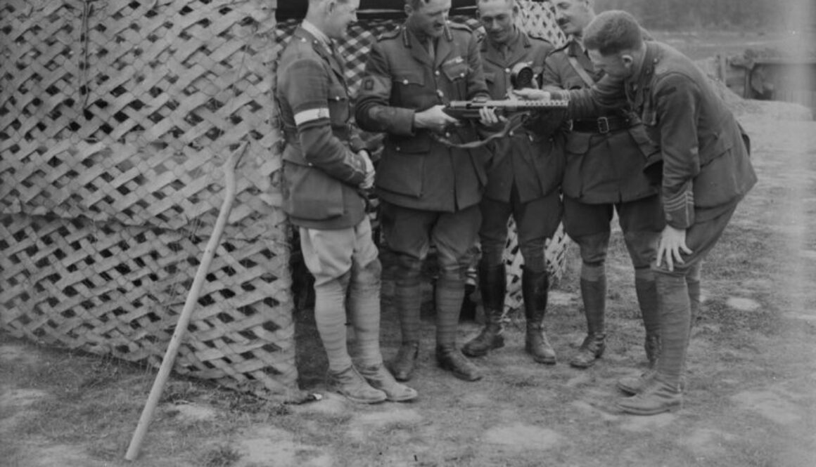 10_Brig.-General Odlum examining automatic rifle. Battle of Amiens. August, 1918